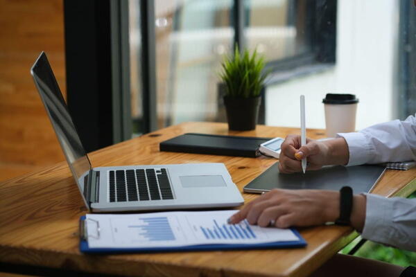 Notebook with a written trading plan on a desk